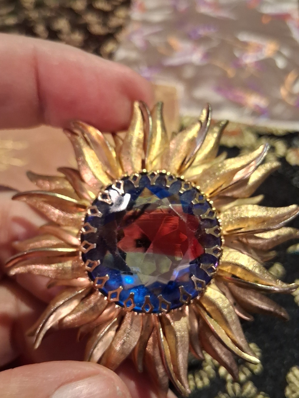 Gold Sunburst Brooch with Multicolor Faceted Stone